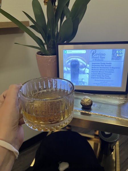 Client receiving head spa treatment